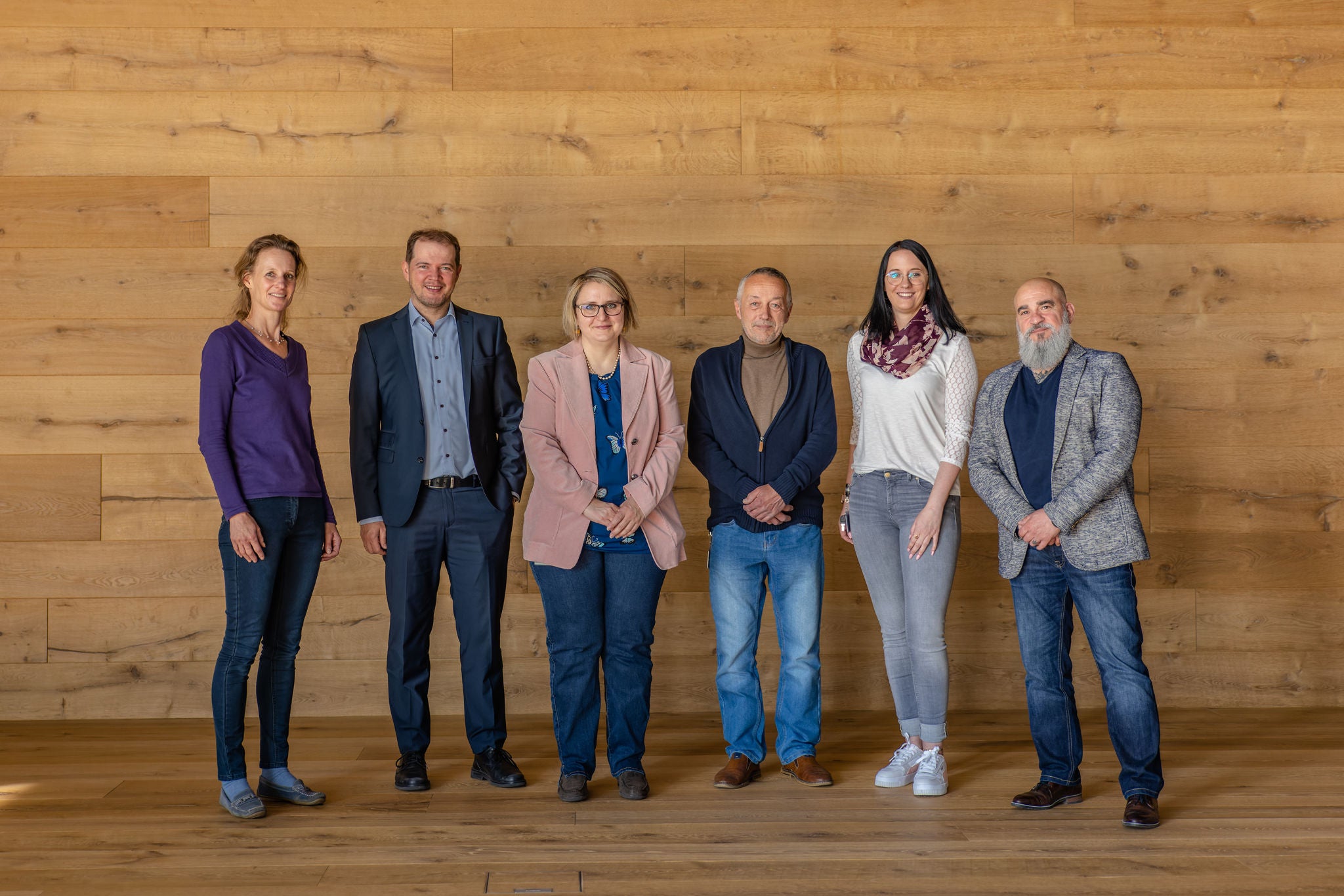 Group Photo in Modern Wooden Interior Group Photo in Modern Wooden Interior