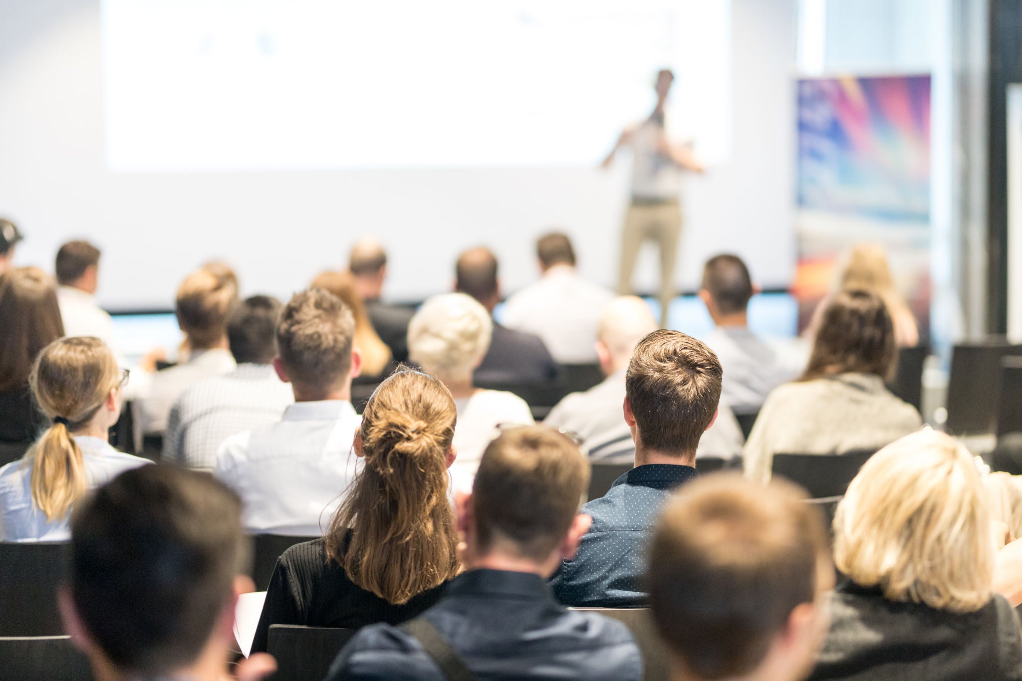 Business Conference Audience Engaged in Presentation