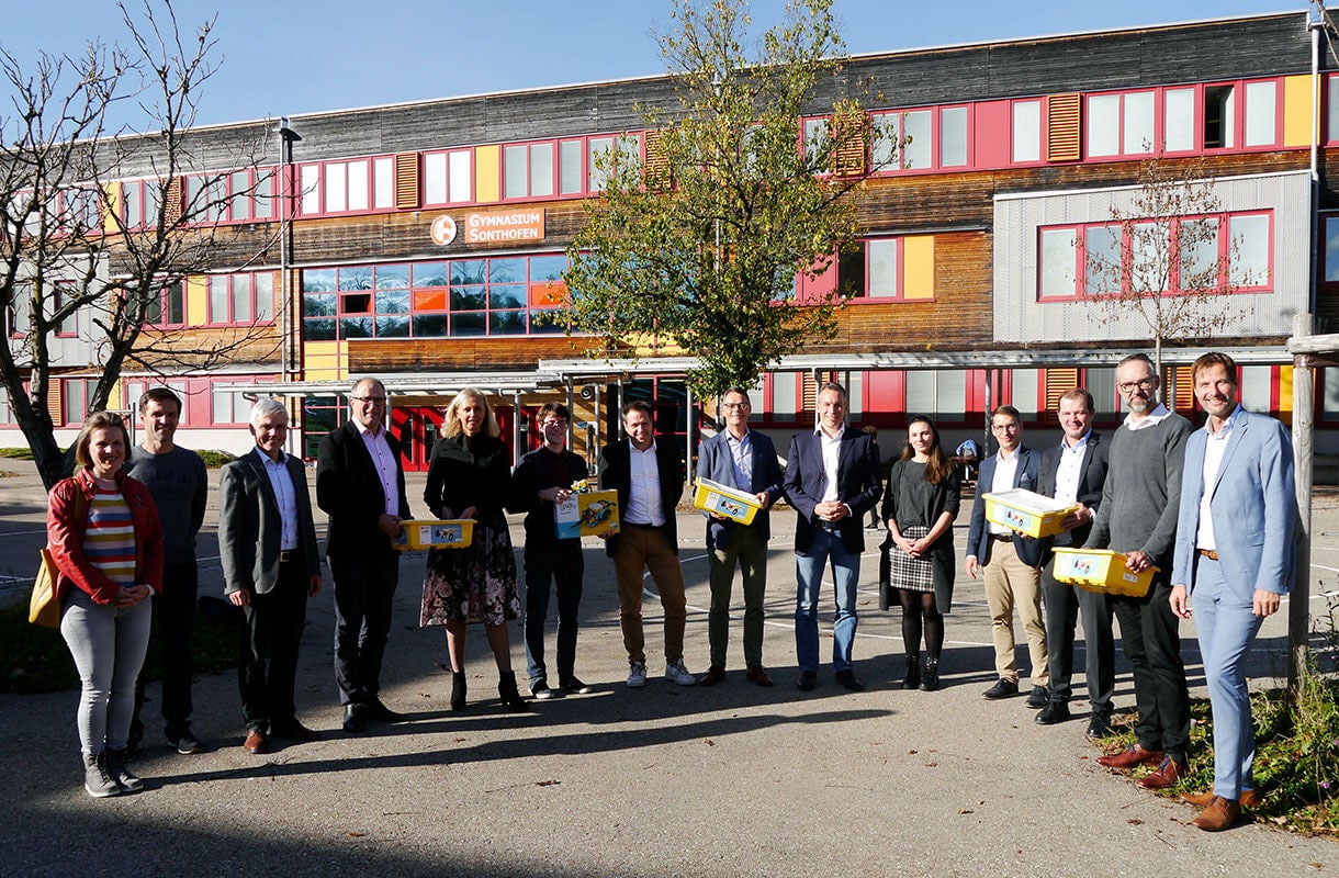 Group Outside School Building with Boxes Group Outside School Building with Boxes