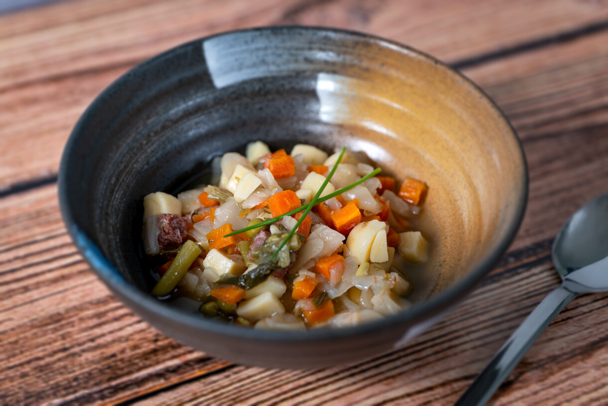 Vegetable Soup Bowl on Wooden Table Vegetable Soup Bowl on Wooden Table