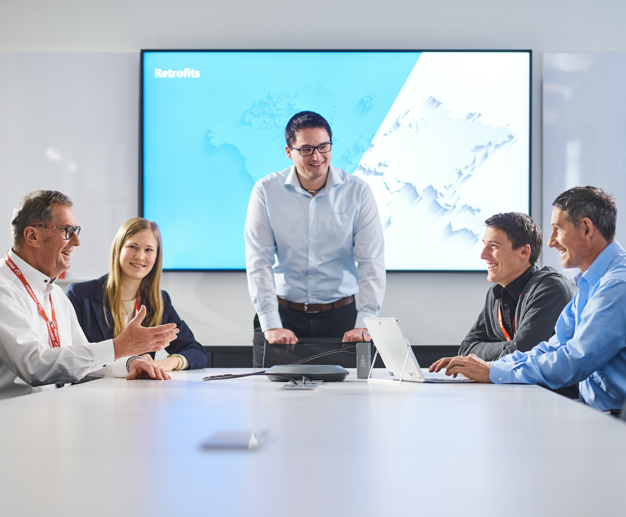 Business Meeting with Presentation Screen