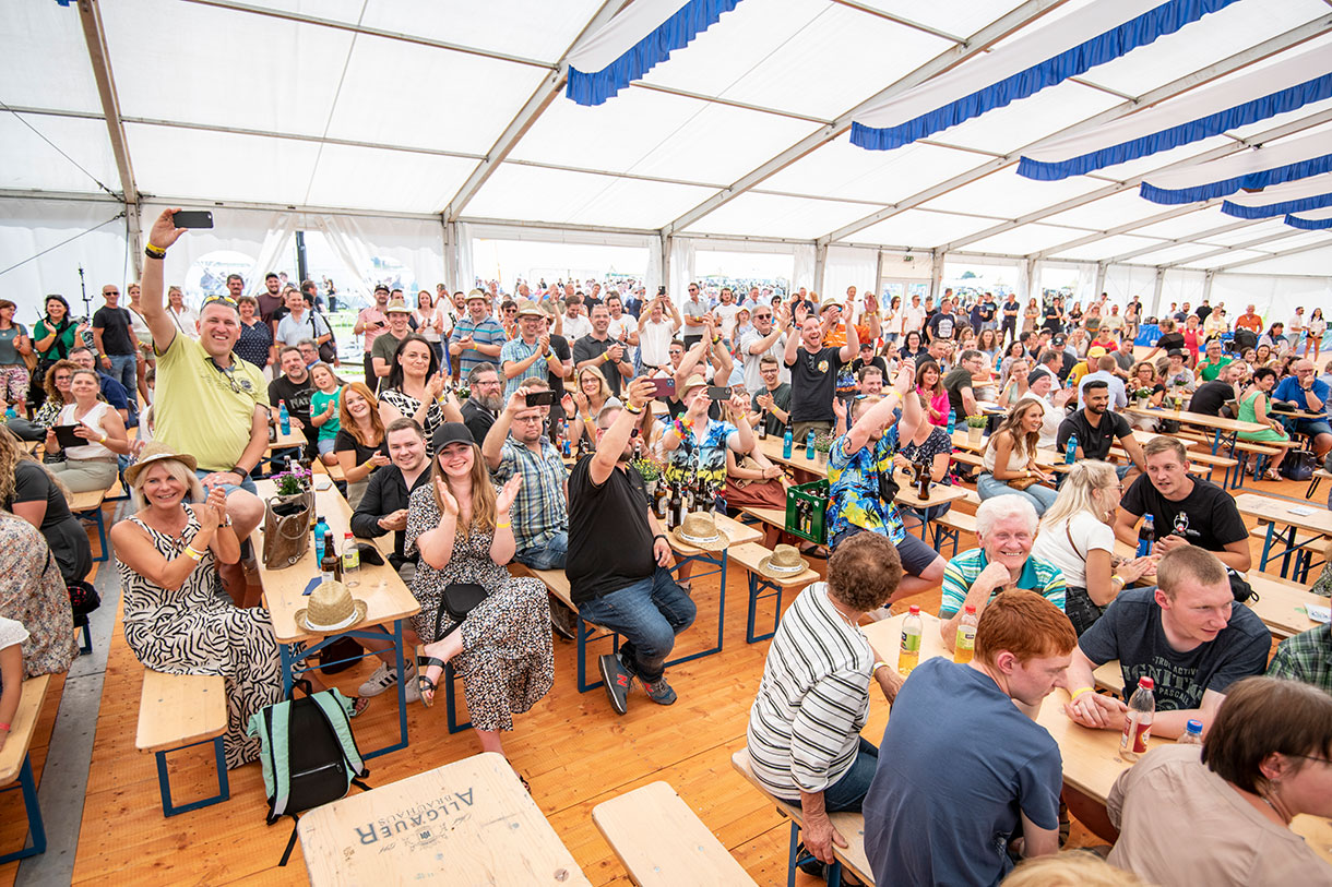 Community Event in Large Tent Gathering Community Event in Large Tent Gathering