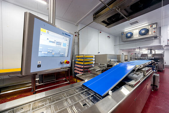 MULTIVAC Packaging Machine in Industrial Setting MULTIVAC Packaging Machine in Industrial Setting