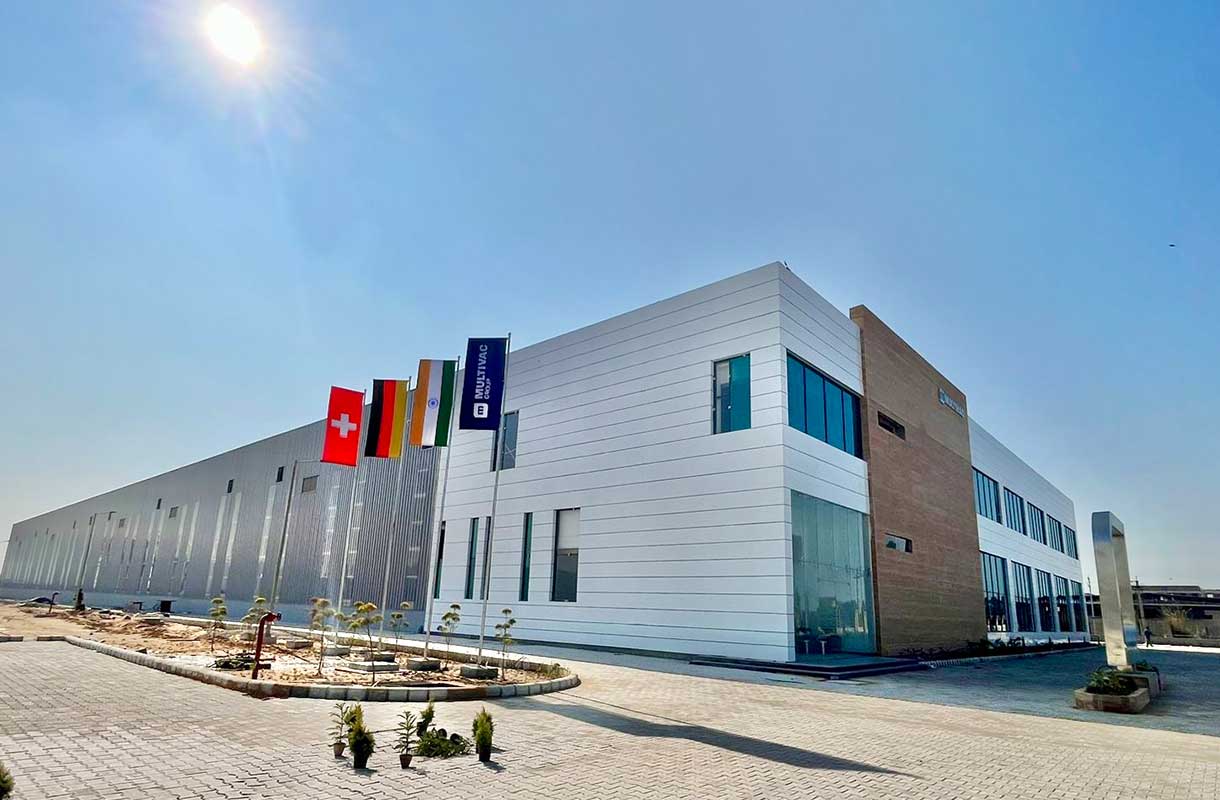 MULTIVAC Factory Exterior Under Clear Blue Sky MULTIVAC Factory Exterior Under Clear Blue Sky