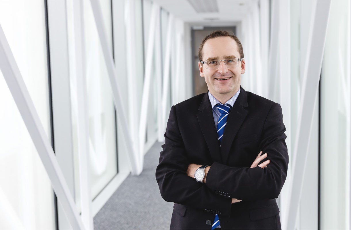 Business Professional in Modern Office Corridor Business Professional in Modern Office Corridor
