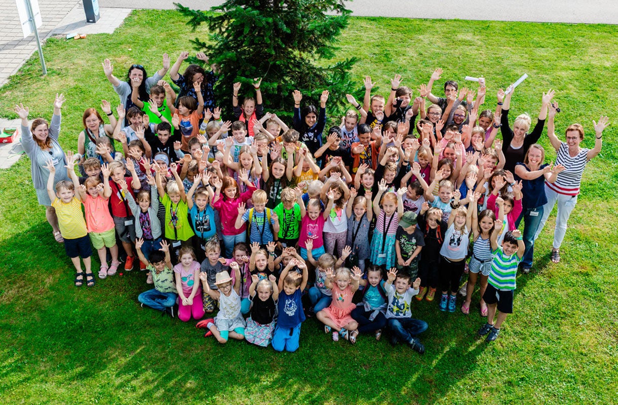 Group of Children Celebrating Outdoors Group of Children Celebrating Outdoors